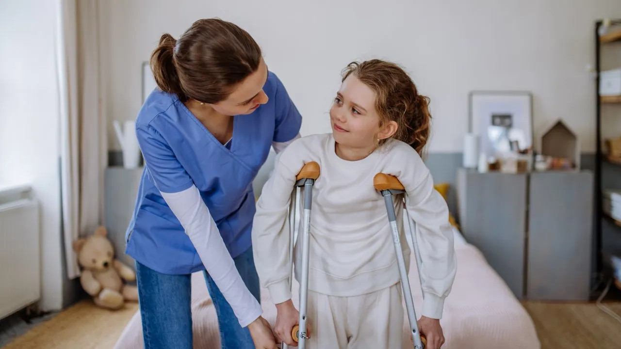picture of orthopedic nurse walking with patient